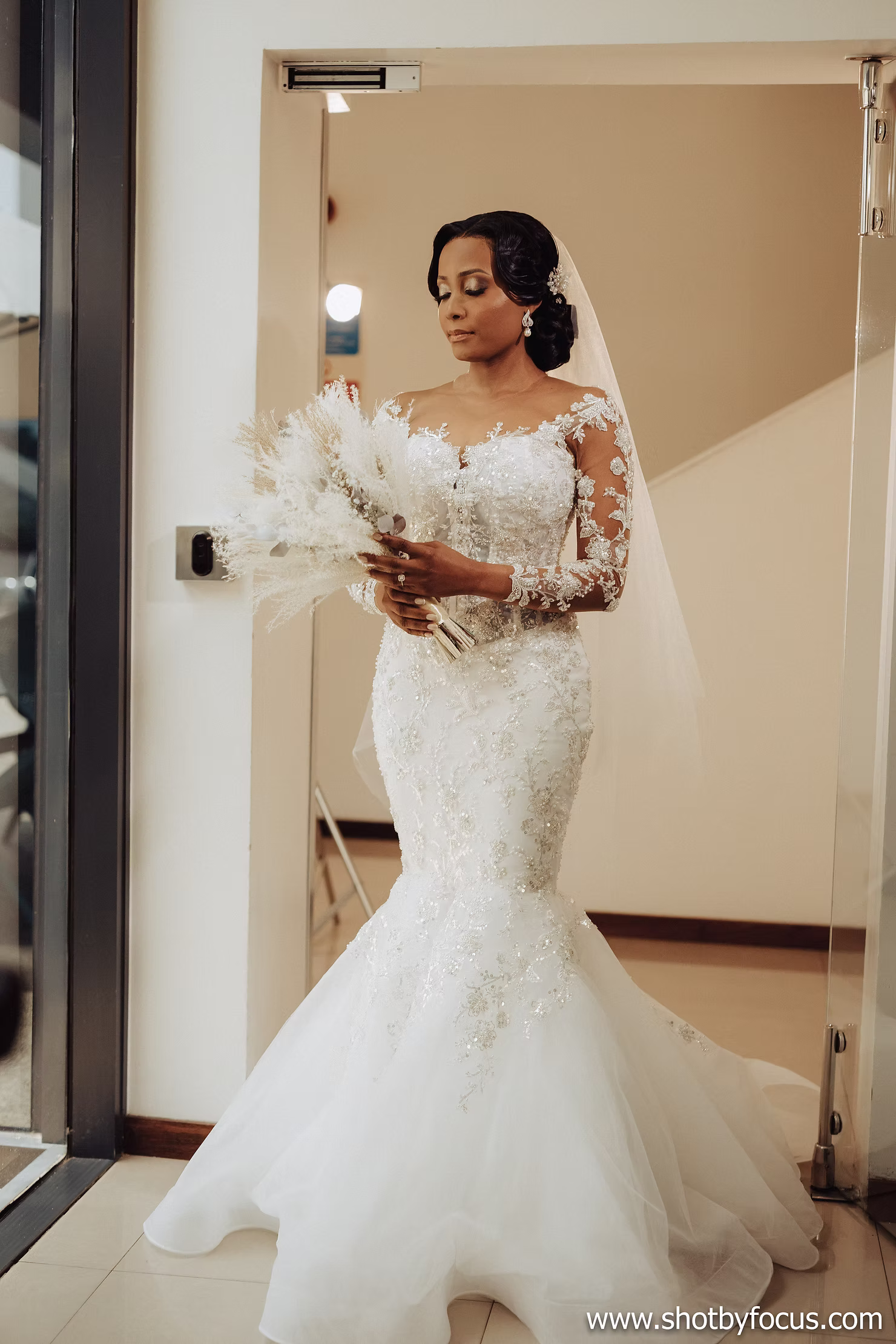 Bride holding a white wedding bouquet